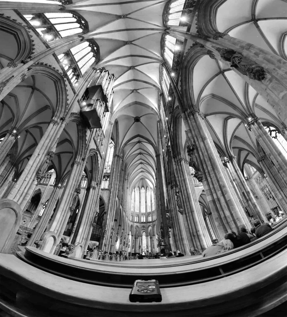 Wide angle panorama shot of Cologne cathedral with an audio recorder on the church pews